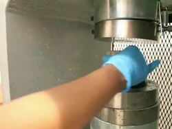 Grabbing cement after strength test.  Stock Footage