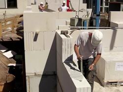 MS Shot of workmen working measurement at house construction / Hermeskeil, Rhineland-Palatinate, Germany Stock Footage