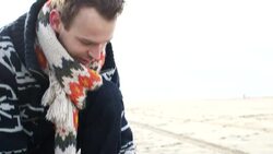 CU TU  Man making kite on beach Stock Footage