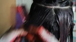 Professional Hairdresser Bleaching Girl's Hair Stock Footage