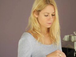 Female in kitchen drinking coffee Stock Footage