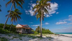 Caribbean Beach with Old House in Cuba Stock Footage