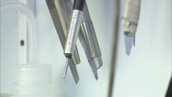 Engraving tools hang in a laboratory. Stock Footage