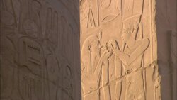 Egyptian hieroglyphics and characters decorate the walls of the Karnak Temple. Stock Footage