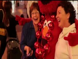 Street performers work the famed Fremont Street strip in Las Vegas, where they troll for tips. The three roommates who dress as Elmo, Elvis and Darth Vader are among those trying to make it in a city that's been hit hard by the recession. News Clip