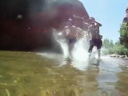 POV of young men running and diving into a river. - Model Released - HD Stock Footage