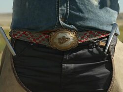 A belt with a metal buckle on a cowboy Stock Footage