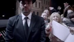 Photographers snap pictures while excited fans clamor over celebrities at red carpet premiere (POV) at awards show Stock Footage