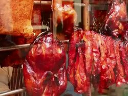 CU TD Crispy Aromatic ducks hanging in store front and chefs preparing food in kitchen at Chinese Restaurant / London, Greater London, UK   Stock Footage
