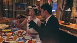 Young newlywed couple feeding each other in Indian style restaurant Stock Footage