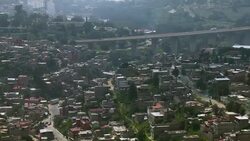 View of bridge leading into crowded Mexico City. Stock Footage