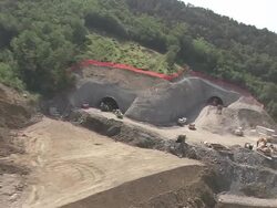 AERIAL over highway construction site on edge of forest/ Slovenia Stock Footage