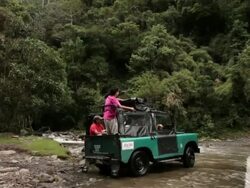 MS TS Men crossing river by Jeep / Salento, Quindio, Colombia  Stock Footage
