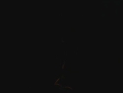 ECU macro tilt down of a lightbulb switching on and off Stock Footage