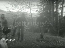 1935: EUROPEAN MOUNTAINS: WS Refugees, displaced persons walking over top of hill. WS People running from building on mountain plateau to greet walking refugees FG.  Jews, Europeans, intellectuals, Passeurs, humanitarian efforts, charity, Resistance. Instructional Video