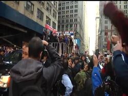 Thousands of fans roared as New York Giants quarterback Eli Manning hoisted the team's Super Bowl trophy from a glittering blue-and-white float Tuesday during a victory parade through New York City. News Clip