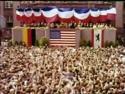 1963 high angle wide shot crowd cheering for President John Kennedy at podium / West Berlin / newsreel Stock Footage