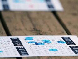 A bingo card with some punched numbers Stock Footage