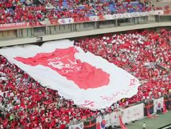 WS SLO MO View of Red Devil (Korean cheering squad) hand raised huge Red Devil T shirt printing Flag at the Seoul World Cup Stadium in Sangam / Seoul, South Korea  Stock Footage