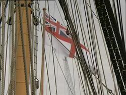 Portsmouth, HMS Victory; rigging tilt down to family exploring and playing on ship. 2004; short sequence. Stock Footage