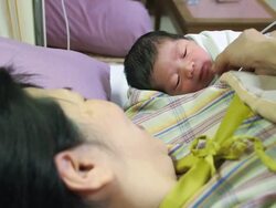 Newborn baby and mother in hospital Stock Footage