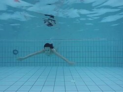 Young woman in a swimming pool Stock Footage