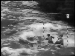 B/W 1961 REAR VIEW 2 Czech men kayaking on rapids in kayaking slalom competition / newsreel Stock Footage