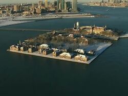Aerial shot of Ellis Island covered in snow NYC Stock Footage