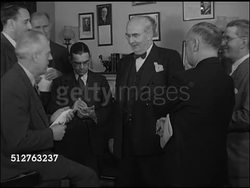 1947: WASHINGTON, D.C.: Chairman of the Senate Foreign Relations Committee Senator Arthur H. Vandenberg (1884-1951) standing in office speaking w/ correspondents (No SOT), reporters taking notes, Vandenberg gesturing w/ hands. Instructional Video