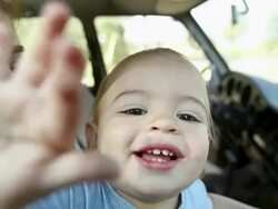Mother and baby son in car, boy banging on window Stock Footage