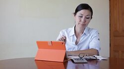 Woman working with her tablet Stock Footage