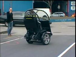 A solution to the world's urban transportation problems could lie in two wheels not four.  General Motors Segway announced Tuesday that they are working together to develop a two-wheeled, two-seat electric vehicle. News Clip