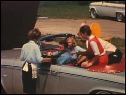 1964 Studebaker Daytona convertible at the beach Stock Footage