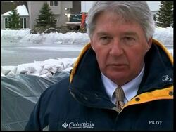 Flood states braces for a blizzard as river recedes News Clip