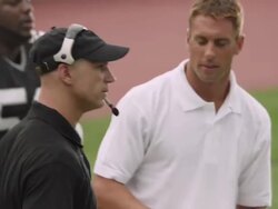 CU, American football coach talking to players on sidelines, Staten Island, New York, USA Stock Footage