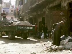 WS View of Garbage habitation with zabbaleen people sorting recyclable materials and uploading truck / Cairo, Egypt Stock Footage