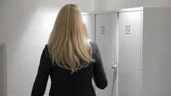 Woman opening locker and taking her bag out Stock Footage