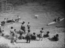 Harbour, citadel, boats, artists, and men playing boules in Villefranche-sur-Mer. French Riviera, 1951 Stock Footage