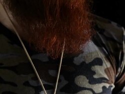 Portrait of man with long beard, large peace sign medal Stock Footage