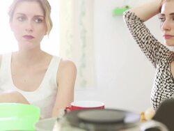 Two woman friends talking at home Stock Footage