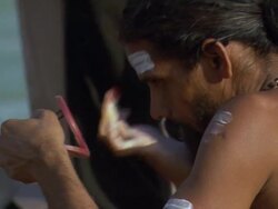 CU Sadhu painting his face /Haridwar, Uttarakhand, India Stock Footage