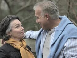 Mature couple talking outdoors Stock Footage