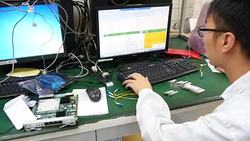 Huawei engineers working with computers News Clip