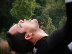 CU View of Man performing tricks with flaming rod / Mississauga, Ontario, Canada. Stock Footage