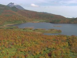 WS AERIAL DS Autumn Lake of city / Hokkaido, Japan Stock Footage