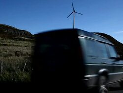Wind turbine and 4x4. Stock Footage