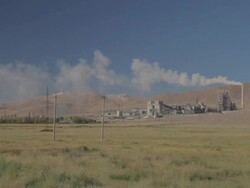Cement Factory on the green field wide shot Stock Footage