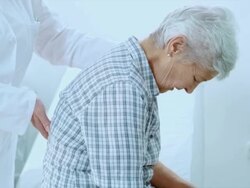 Physician checking the patients spine for irregularities Stock Footage