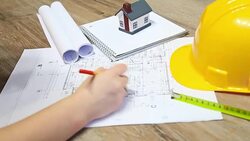 young architect working on blueprints Stock Footage