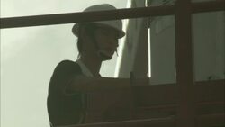 A technician inspects equipment on a radar tower. Stock Footage
